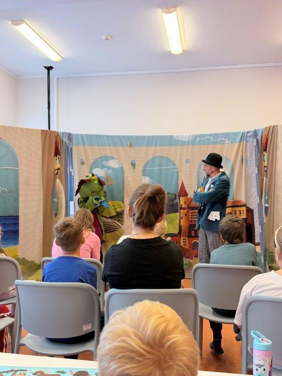 Actors performing The Tale of the Old Clock at a children's hospital ward